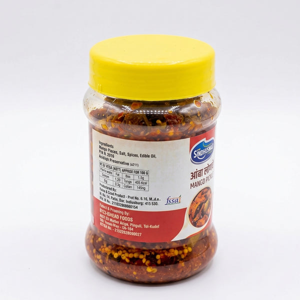 A jar of Srigarhanchi Mango Chutney with a bright yellow lid, showing the red and yellow chutney inside a clear glass container on a white background.