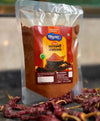 Premium whole Indian spices, including stone flower, triphala, and dried red chilies, used to blend authentic Sindhuswad Malvani masala.