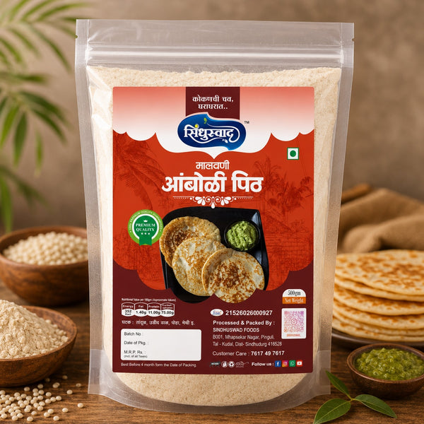 A stand-up pouch of Singhlafood's 'Aalooji Aaloo' (eggless pancakes) is displayed on a rustic wooden table surrounded by ingredients like whole grains, cooked pancakes, and green chutney.