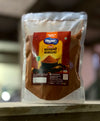 Back panel of Sindhuswad Malvani Masala packet showing 100% natural ingredients list, nutritional values, and manufacturing details
