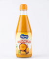 Close-up shot of the premium glass neck of a Sindhuswad bottle, emphasizing the thick, fiber-rich consistency of pure Konkan Alphonso mango pulp inside.