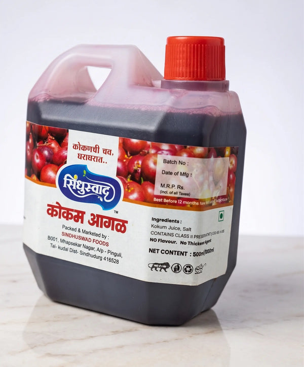 Angled shot of the heavy-duty Sindhuswad Kokam Aagal plastic bottle container showing the dark purple liquid extract inside, perfect for making traditional Solkadhi.
